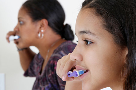Brushing teeth together 454x300