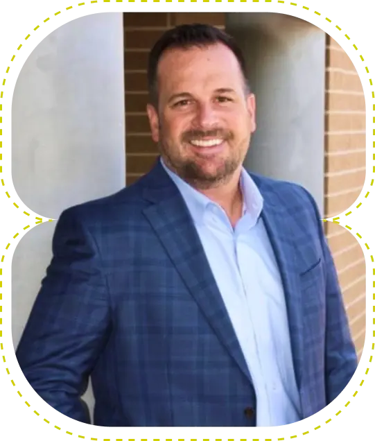 Dr. Adam Preece, dentist at McKinney dental practice, smiling in professional portrait.