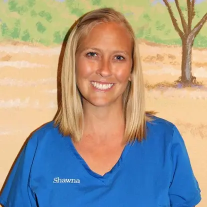 Shawna, registered dental assistant, smiles at McKinney dental practice.